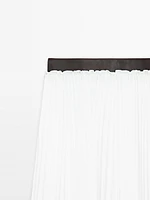 Pleated skirt with leather detail