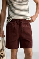DRAWSTRING SWIM TRUNKS