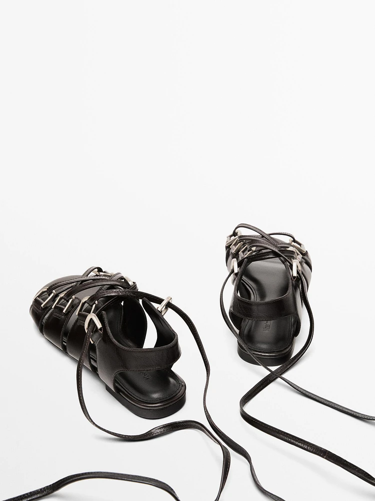 Lace-up sandals with rings