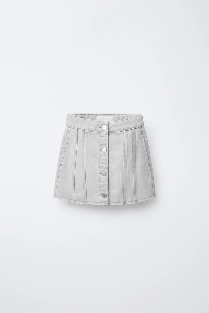 JUPE EN DENIM À COUPES EFFILOCHÉES