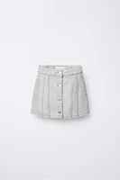 JUPE EN DENIM À COUPES EFFILOCHÉES