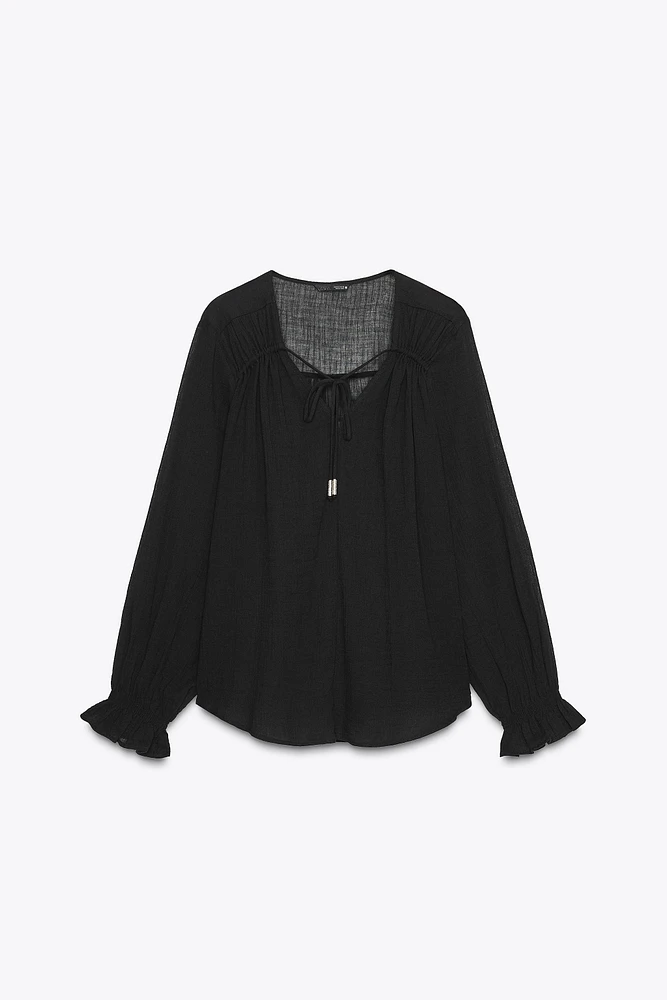 BLOUSE SEMI-TRANSPARENTE