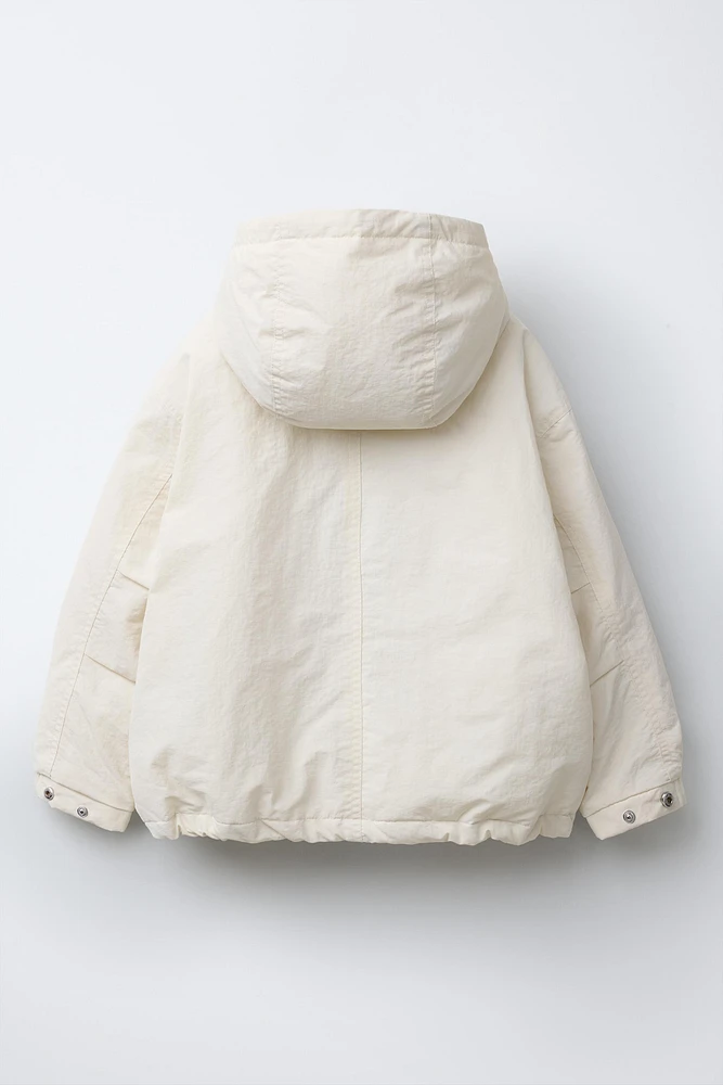 BLOUSON À CAPUCHE