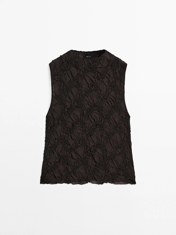 Creased-effect funnel neck top
