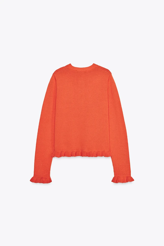GILET EN MAILLE À VOLANTS