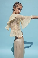 BLOUSE EN MAILLE POINTELLE À VOLANTS