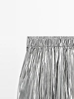 Flowing metallic trousers with gathered detail