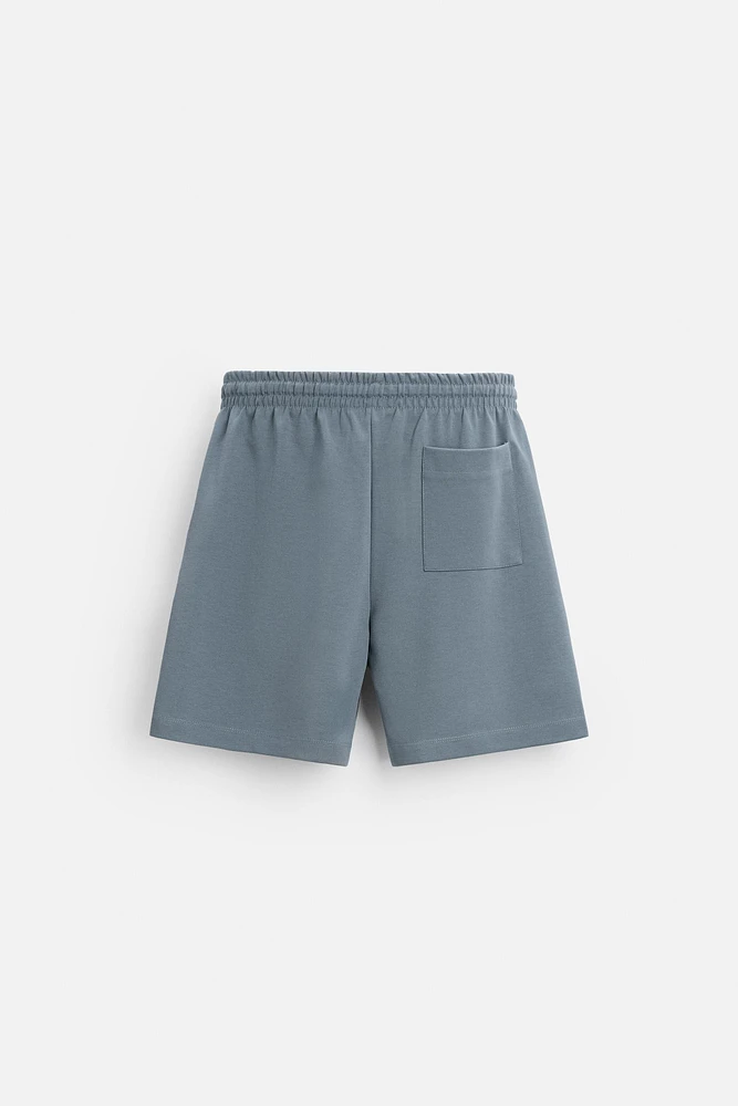 INTERLOCK STRUCTURED SHORTS