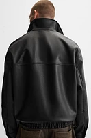 BLOUSON EN MATIÈRE SYNTHÉTIQUE