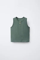 T-SHIRT SANS MANCHES BOUTONS