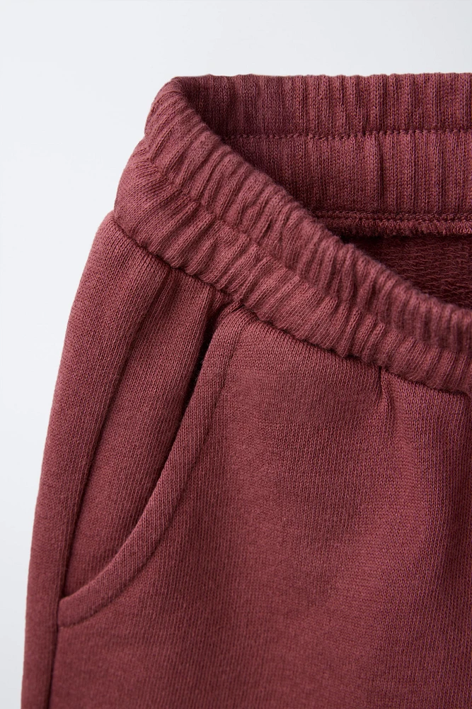 EMBROIDERED PLUSH SHORTS