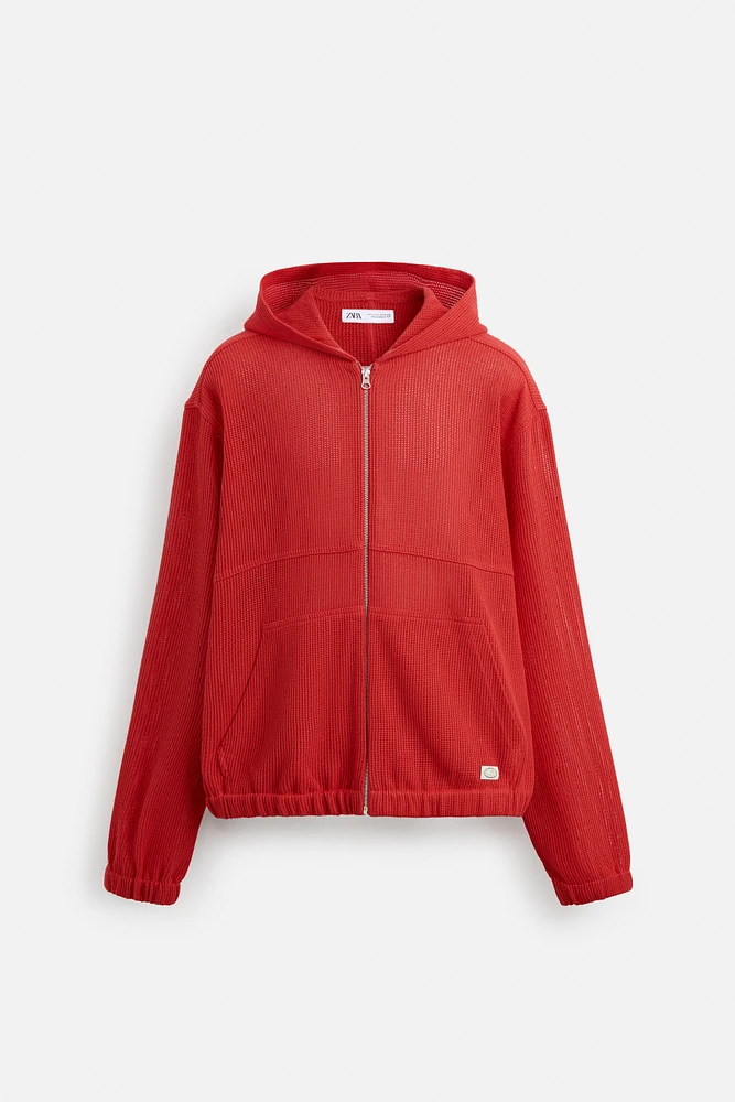 VESTE STRUCTURE OUVERTE CAPUCHE