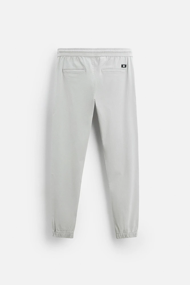 PANTALON DÉLAVÉ AVEC TAILLE JOGGING