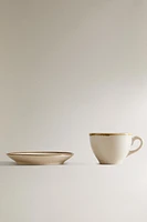 PORCELAIN TEACUP WITH ANTIQUE FINISH RIM