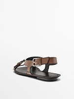Flat leather sandals with buckles