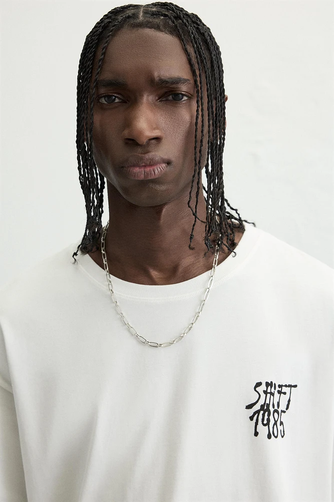 T-SHIRT À INSCRIPTION GRAFFITI