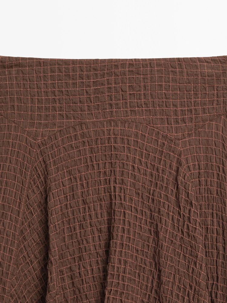 Jupe fluide à carreaux bas asymétrique