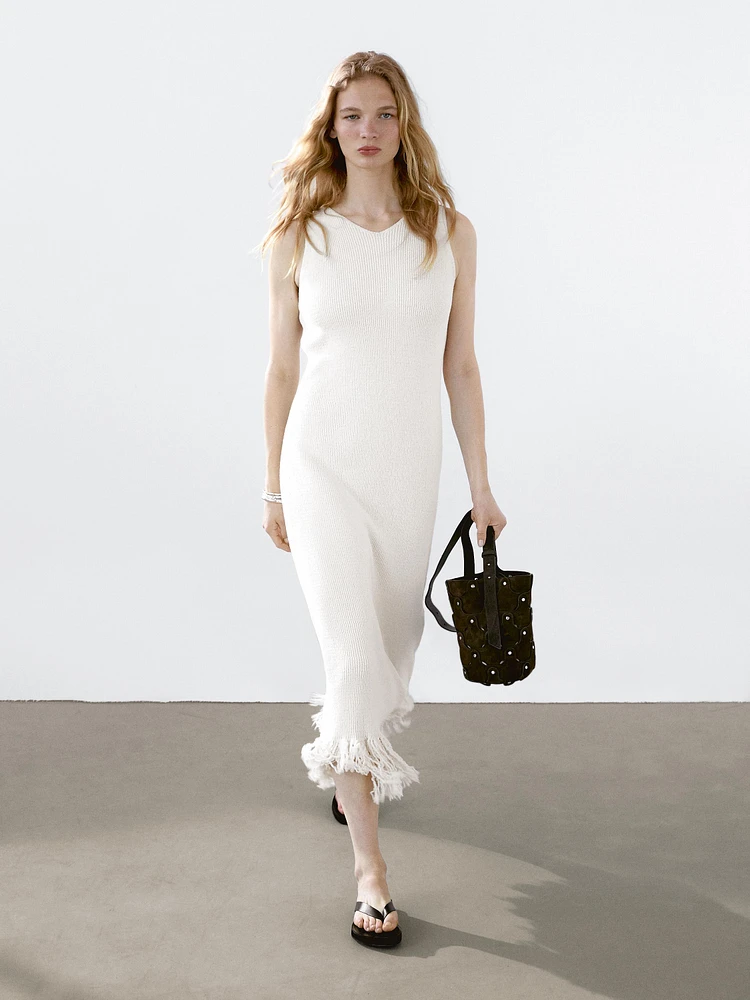 Knit dress with fringed hem