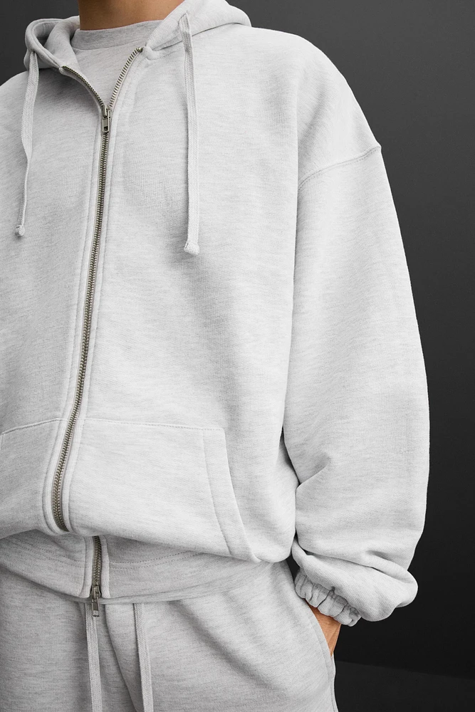 SWEAT À CAPUCHE ET ZIP