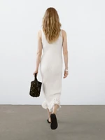 Knit dress with fringed hem