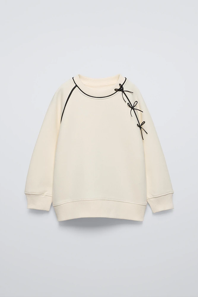 SWEATSHIRT WITH BOWS