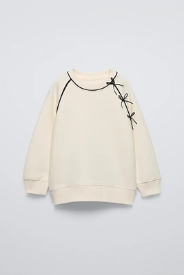 SWEATSHIRT WITH BOWS