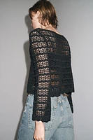 PULL COURT EN MAILLE POINTELLE