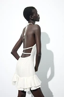 ROBE MINI HALTER À VOLANTS