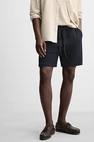 TEXTURED REGULAR FIT BERMUDA SHORTS