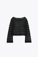 PULL COURT EN MAILLE POINTELLE