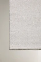 LIGHT-COLORED WOOL AREA RUG