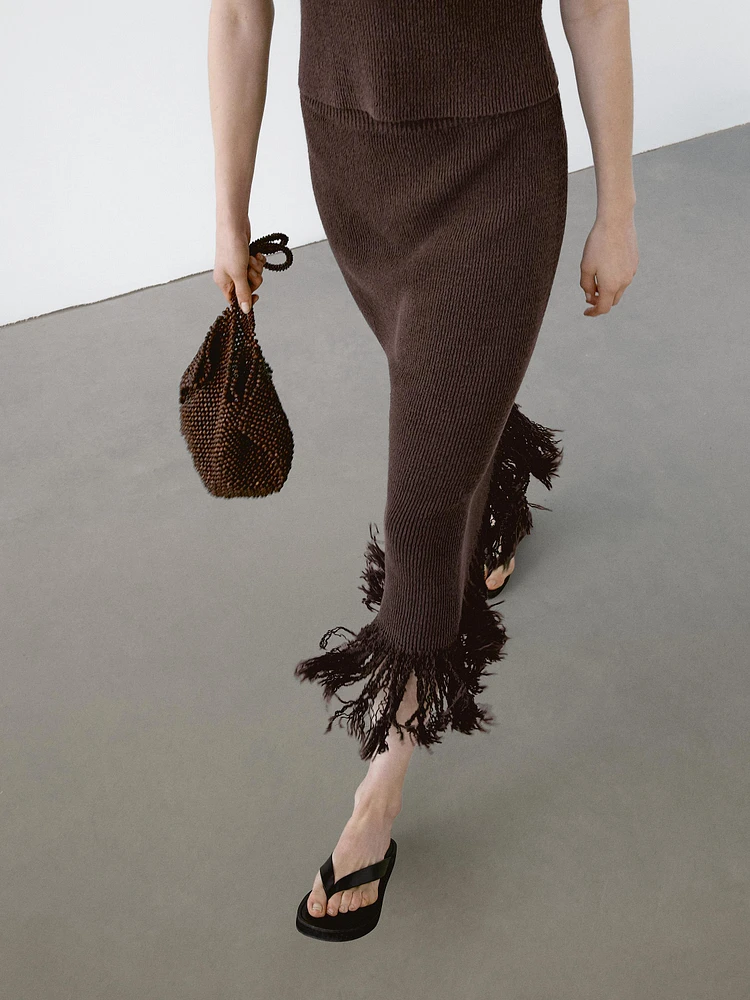 Long knit skirt with fringed hem