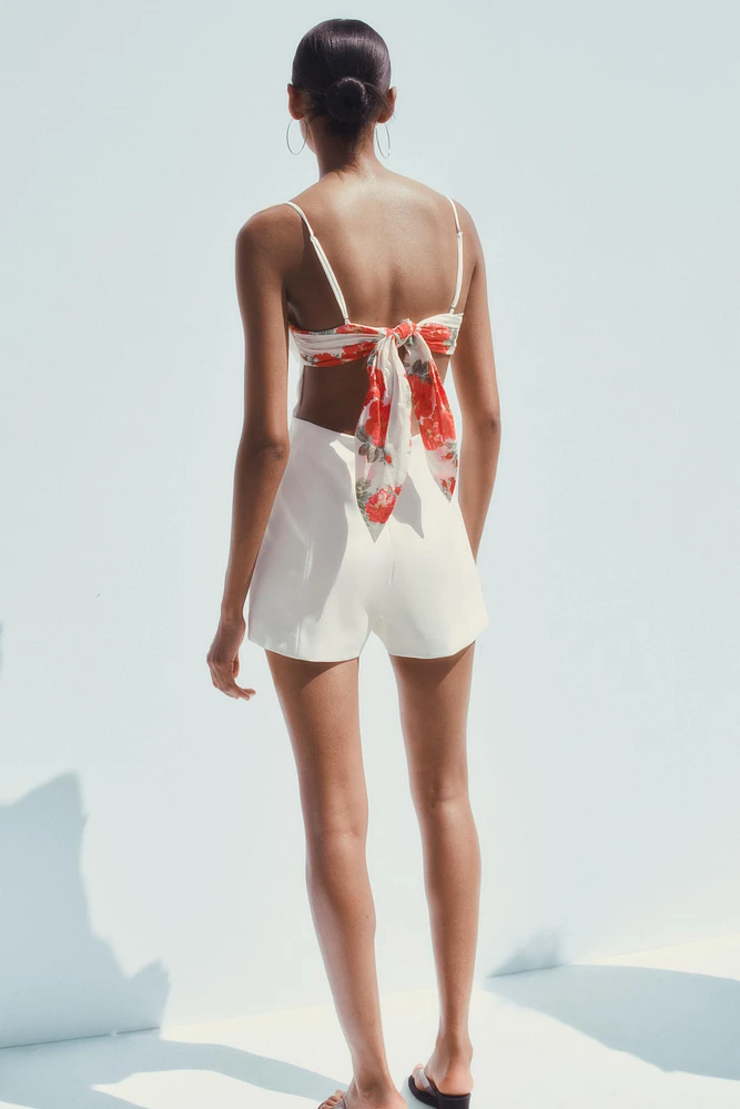 CUT OUT HANDKERCHIEF SHORT JUMPSUIT