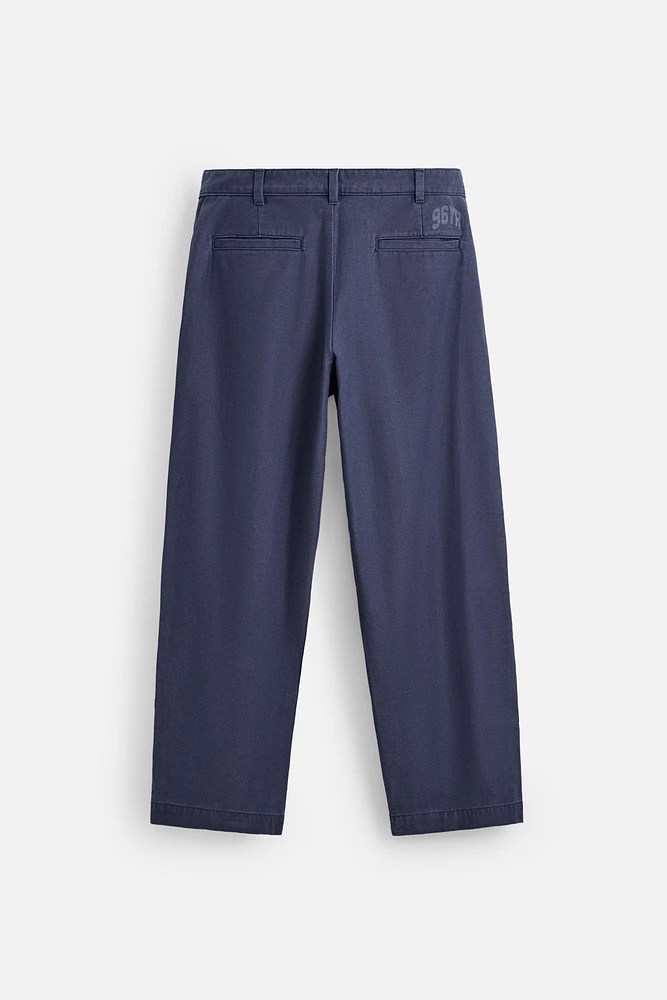 RELAXED FIT PLEATED PANTS