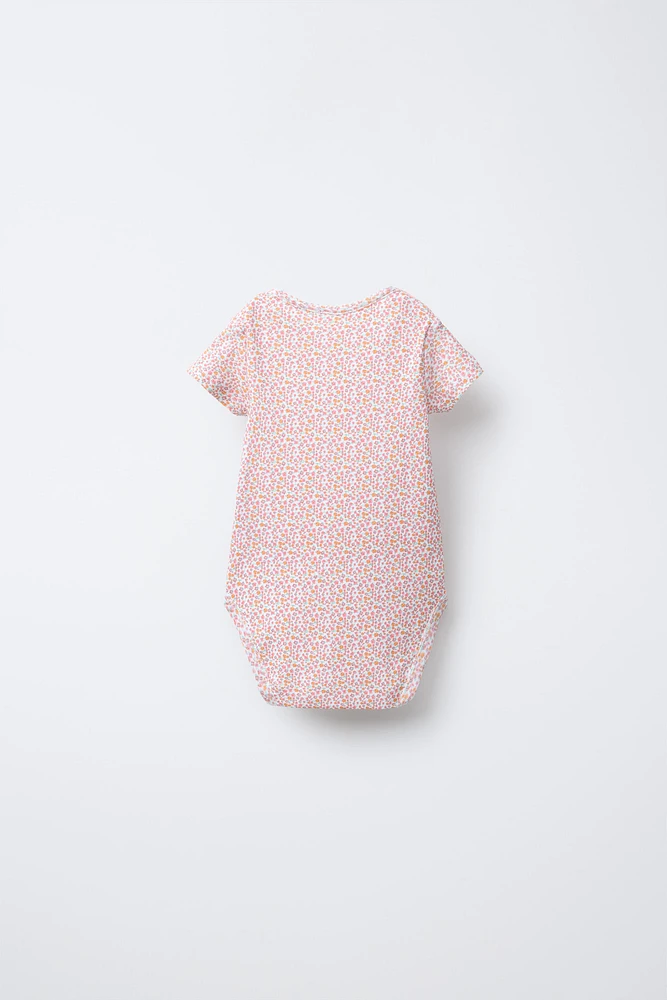 FIVE-PACK OF PATCHWORK BODYSUITS
