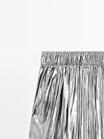 Flowing metallic trousers with gathered detail