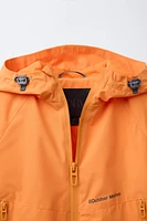 VESTE LÉGÈRE À CAPUCHE DÉPERLANTE