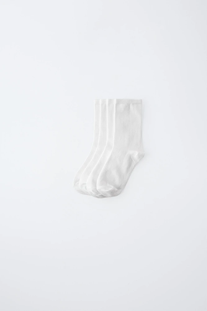 LOT DE QUATRE CHAUSSETTES LONGUES