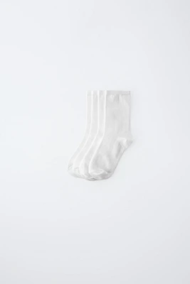 LOT DE QUATRE CHAUSSETTES LONGUES