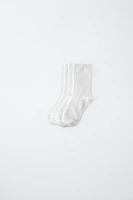 LOT DE QUATRE CHAUSSETTES LONGUES