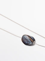 Necklace with ceramic pendant