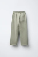PANTALON DROIT AVEC ÉTIQUETTE AUTOCOLLANTE