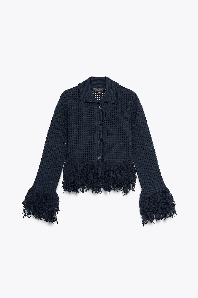 GILET EN MAILLE À CARREAUX AVEC FRANGES