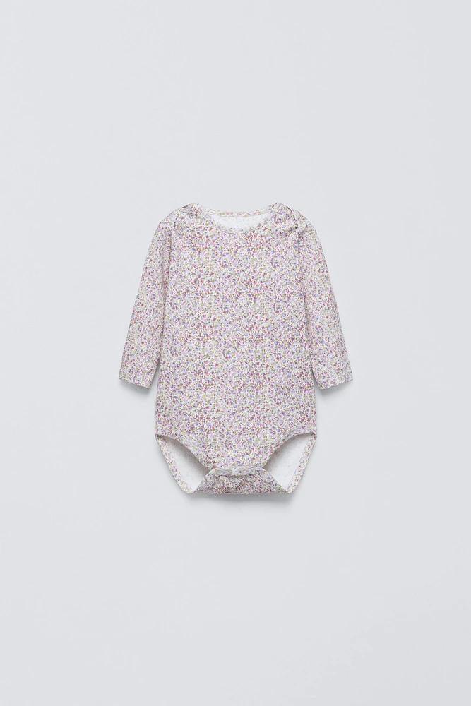 FIVE PACK OF FLORAL BODYSUITS