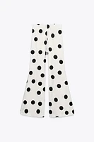 PANTALON FLARE À POIS TAILLE HAUTE