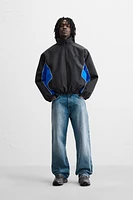 BLOUSON TECHNIQUE AVEC BLOCS DE COULEUR