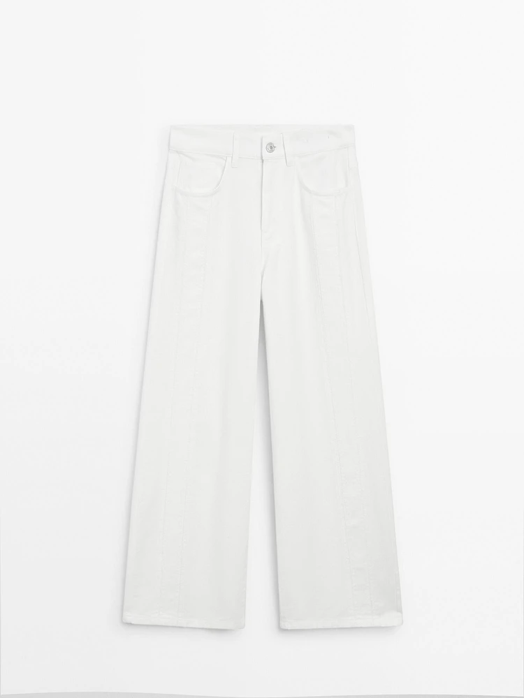 Jean wide leg taille haute avec découpes