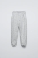 FLOCKED TEXT JOGGING PANTS