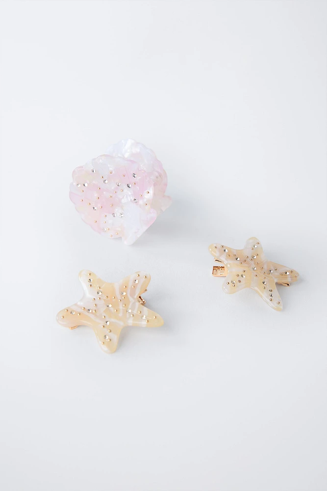 LOT DE TROIS PINCES COQUILLAGE ET ÉTOILES
