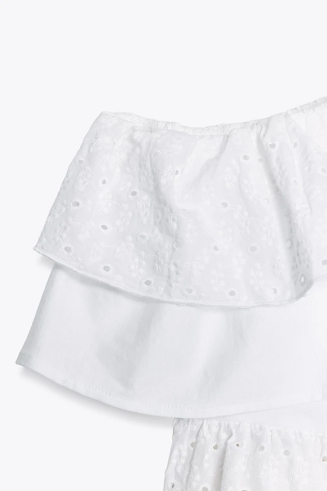 TOP ASYMÉTRIQUE BRODÉ